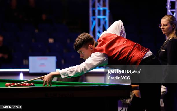 Liam Davies of Wales plays a shot in the second round match against Scott Donaldson of Scotland on day 5 of the Cazoo World Championship 2023...