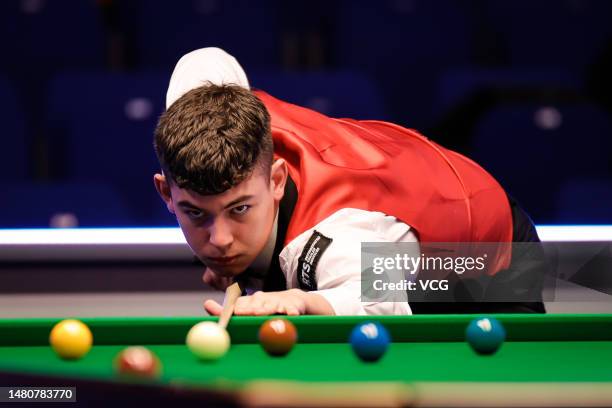 Liam Davies of Wales plays a shot in the second round match against Scott Donaldson of Scotland on day 5 of the Cazoo World Championship 2023...