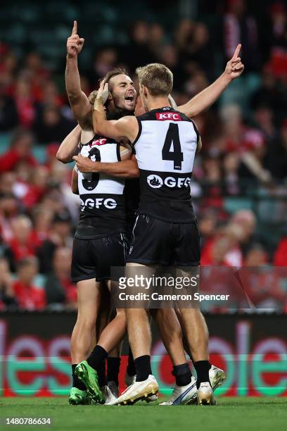 Jeremy Finlayson celebrates kicking a goal with team mates during the round four AFL match between Sydney Swans and Port Adelaide Power at Sydney...