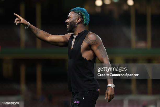 Singer Jason Derulo waves to fans following the round four AFL match between Sydney Swans and Port Adelaide Power at Sydney Cricket Ground, on April...