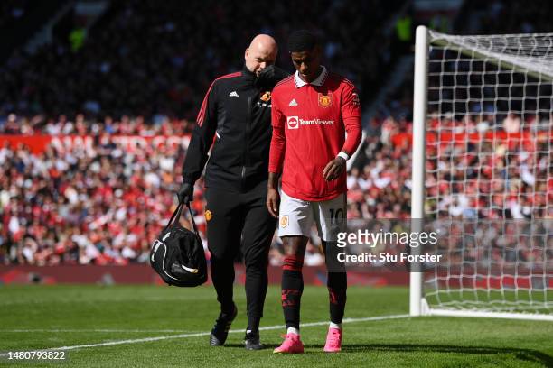 Marcus Rashford of Manchester United leaves the pitch due to an injury during the Premier League match between Manchester United and Everton FC at...