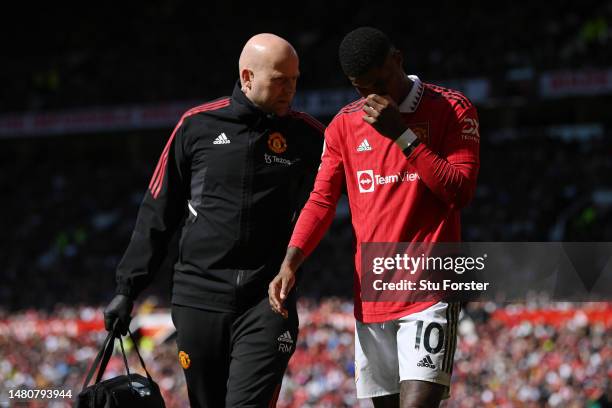 Marcus Rashford of Manchester United leaves the pitch due to an injury during the Premier League match between Manchester United and Everton FC at...