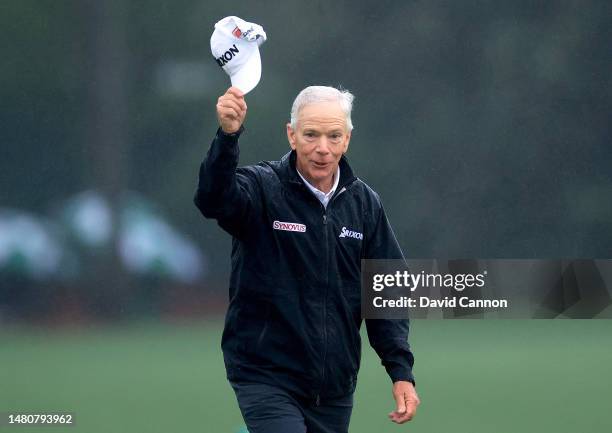 Larry Mize of The United States waves to the patrons as he walks onto the 18th green in his last Masters Tournament during the completion of the...