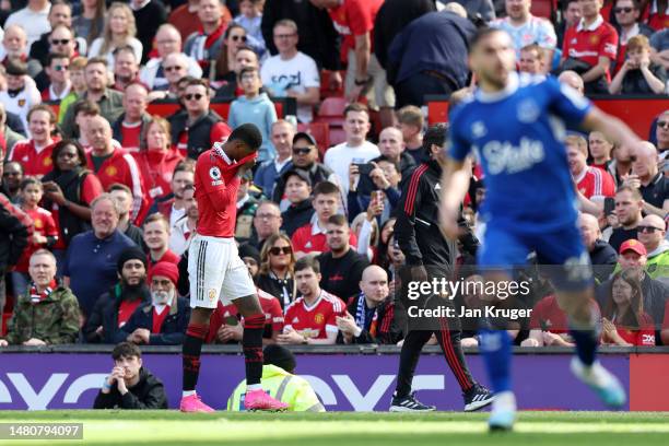 Marcus Rashford of Manchester United leaves the pitch due to an injury during the Premier League match between Manchester United and Everton FC at...