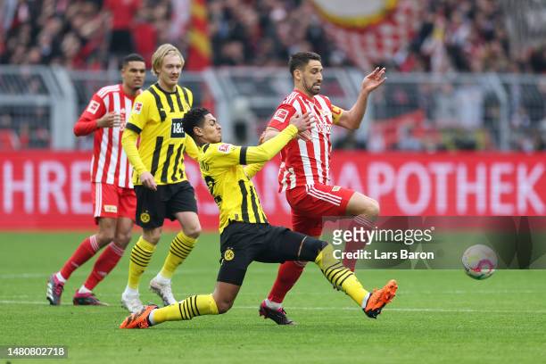 Rani Khedira of 1.FC Union Berlin is challenged by Jude Bellingham of Borussia Dortmund during the Bundesliga match between Borussia Dortmund and 1....