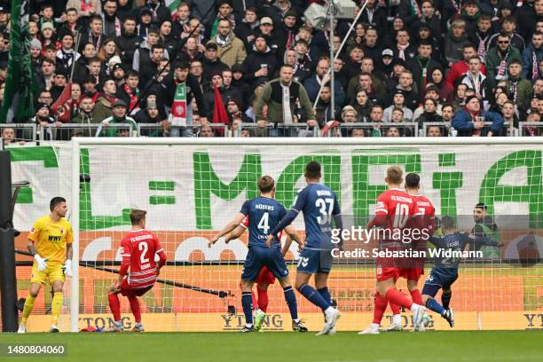 Ellyes Skhiri of 1.FC Koln scores their sides first goal during the Bundesliga match between FC Augsburg and 1. FC Köln at WWK-Arena on April 08,...