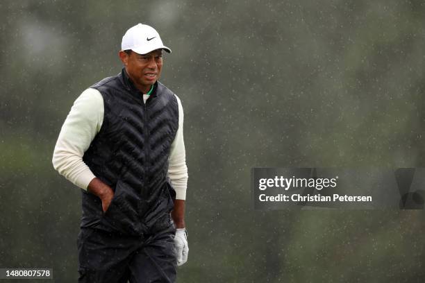 Tiger Woods of the United States looks on from the 18th green during the continuation of the weather delayed second round of the 2023 Masters...