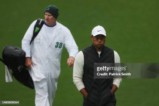 Tiger Woods of the United States reacts on the 18th hole during the continuation of the weather delayed second round of the 2023 Masters Tournament...