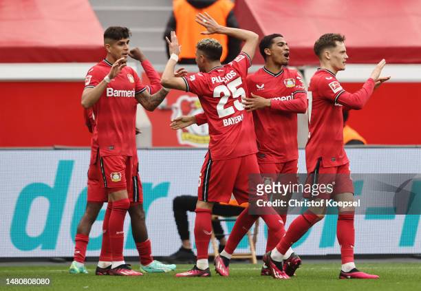 Bayer 04 Leverkusen players celebrate after Moussa Diaby scores the team's second goal during the Bundesliga match between Bayer 04 Leverkusen and...