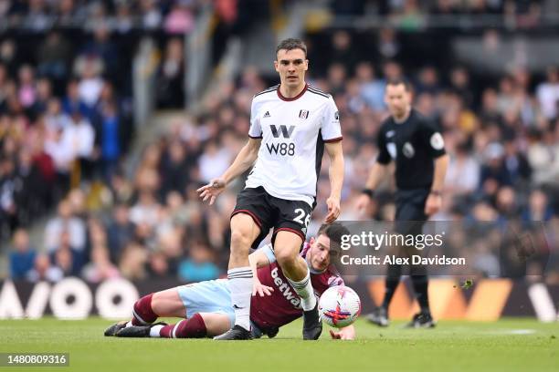 Joao Palhinha of Fulham is challenged by Declan Rice of West Ham United during the Premier League match between Fulham FC and West Ham United at...