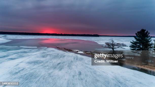 detroit point icy cerry red sunrise - horizon over water stock pictures, royalty-free photos & images