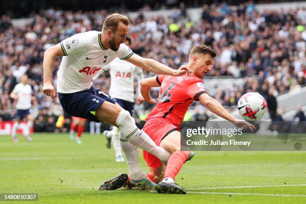 Harry Kane of Tottenham Hotspur is challenged by Joel Veltman of Brighton & Hove Albion during the Premier League match between Tottenham Hotspur and...