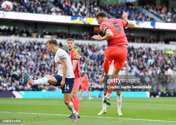 Lewis Dunk of Brighton & Hove Albion scores the team's first goal during the Premier League match between Tottenham Hotspur and Brighton & Hove...