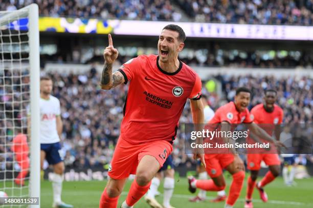 Lewis Dunk of Brighton & Hove Albion celebrates after scoring the team's first goal during the Premier League match between Tottenham Hotspur and...