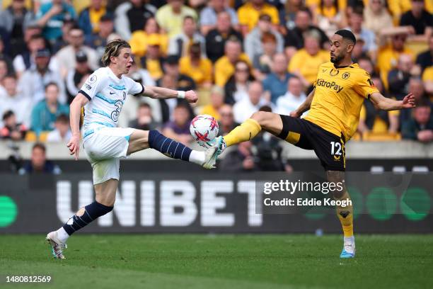 Conor Gallagher of Chelsea battles for possession with Matheus Cunha of Wolverhampton Wanderers during the Premier League match between Wolverhampton...