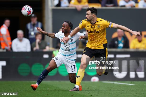 Raheem Sterling of Chelsea battles for possession with Max Kilman of Wolverhampton Wanderers during the Premier League match between Wolverhampton...