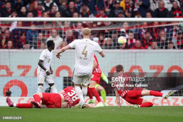 Matthijs de Ligt of Bayern Munich scores their sides first goal during the Bundesliga match between Sport-Club Freiburg and FC Bayern München at...