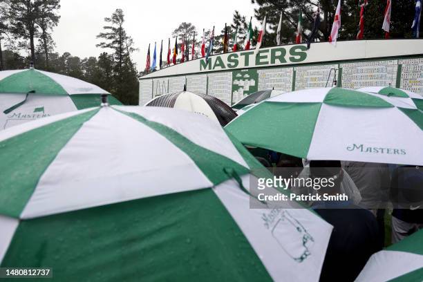 General view of the leaderboard as patrons look on during the continuation of the weather delayed second round of the 2023 Masters Tournament at...
