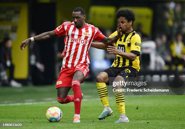 Sheraldo Becker of 1.FC Union Berlin fouls Karim Adeyemi of Borussia Dortmund during the Bundesliga match between Borussia Dortmund and 1. FC Union...