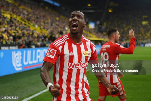 Sheraldo Becker of 1.FC Union Berlin celebrates after Kevin Behrens of 1.FC Union Berlin scores their sides first goal during the Bundesliga match...