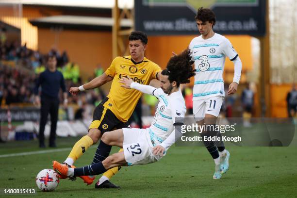 Matheus Nunes of Wolverhampton Wanderers is fouled by Marc Cucurella of Chelsea during the Premier League match between Wolverhampton Wanderers and...