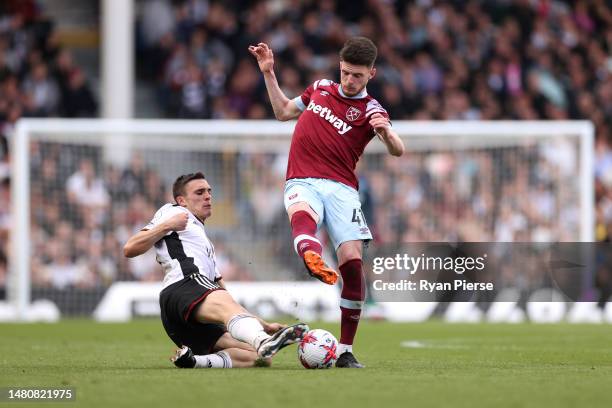 Joao Palhinha of Fulham battles for possession with Declan Rice of West Ham United during the Premier League match between Fulham FC and West Ham...