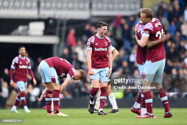 Declan Rice of West Ham United celebrates after the team's victory during the Premier League match between Fulham FC and West Ham United at Craven...