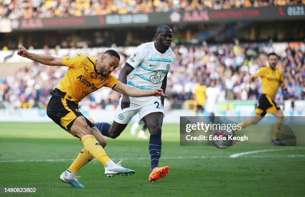 Matheus Cunha of Wolverhampton Wanderers shoots past Kalidou Koulibaly of Chelsea during the Premier League match between Wolverhampton Wanderers and...