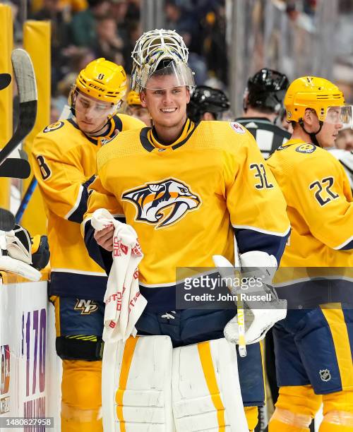 Kevin Lankinen of the Nashville Predators smiles during a break in play against the Vegas Golden Knights during an NHL game at Bridgestone Arena on...