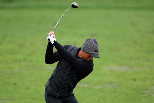 Tiger Woods of the United States warms up on the practice area during the third round of the 2023 Masters Tournament at Augusta National Golf Club on...