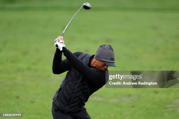 Tiger Woods of the United States warms up on the practice area during the third round of the 2023 Masters Tournament at Augusta National Golf Club on...