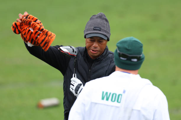 Tiger Woods of the United States looks on from the practice area during the third round of the 2023 Masters Tournament at Augusta National Golf Club...