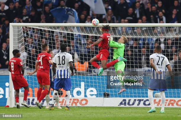 Mohamed Simakan of RB Leipzig scores their sides first goal during the Bundesliga match between Hertha BSC and RB Leipzig at Olympiastadion on April...