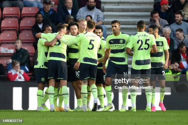 Erling Haaland of Manchester City celebrates with teammates after scoring the team's first goal during the Premier League match between Southampton...