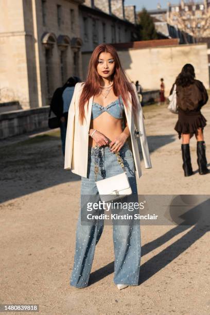 Caroline Hu wears all Givenchy outside the Givenchy show on March 02, 2023 in Paris, France.