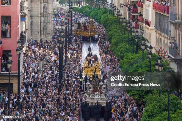 Several pasos participating in the Santo Entierro Grande along the Av de la Constitucion on the way to the Cathedral on April 8, 2023 in Seville....