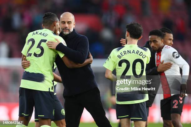 Pep Guardiola embraces Manuel Akanji of Manchester City after the team's victory during the Premier League match between Southampton FC and...