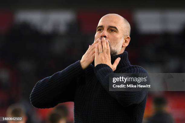 Pep Guardiola, Manager of Manchester City, acknowledges the fans after the team's victory during the Premier League match between Southampton FC and...