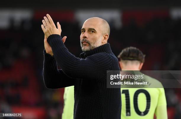 Pep Guardiola, Manager of Manchester City, acknowledges the fans after the team's victory during the Premier League match between Southampton FC and...