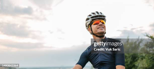 portrait of a cyclist - protective sportswear stock pictures, royalty-free photos & images