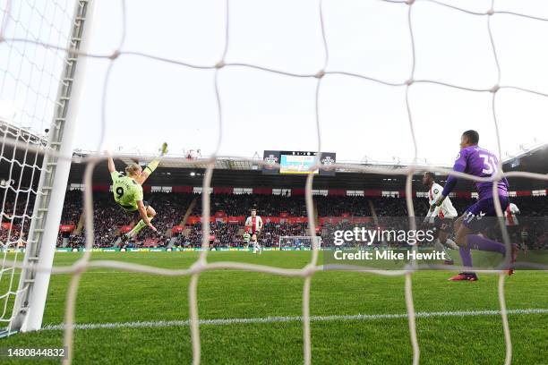 Erling Haaland of Manchester City scores the team's third goal past Gavin Bazunu of Southampton during the Premier League match between Southampton...