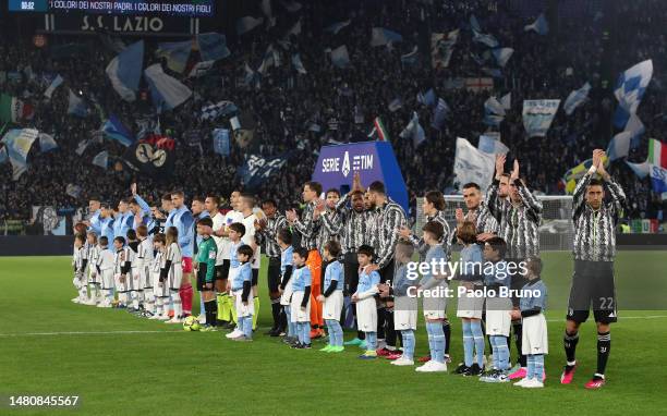 Players of Juventus applaud fans while lining up prior to the Serie A match between SS Lazio and Juventus at Stadio Olimpico on April 08, 2023 in...