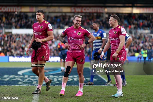 Stuart Hogg celebrates as they speak with Joe Simmonds after their side's victory during the Heineken Champions Cup Quarter Finals match between...