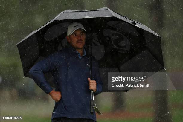 Brooks Koepka of the United States looks on from the seventh green during the third round of the 2023 Masters Tournament at Augusta National Golf...