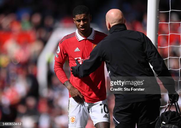 Marcus Rashford of Manchester United leaves the field with an injury during the Premier League match between Manchester United and Everton FC at Old...