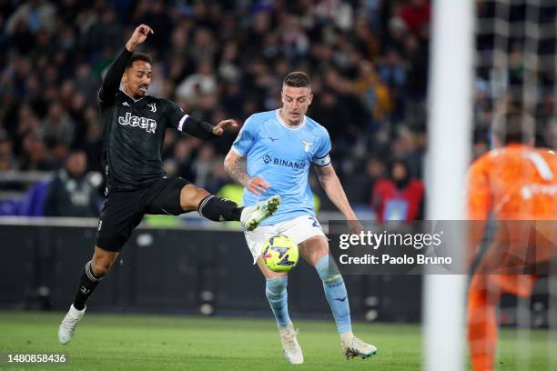 Sergej Milinkovic-Savic of SS Lazio is challenged by Danilo of Juventus during the Serie A match between SS Lazio and Juventus at Stadio Olimpico on...