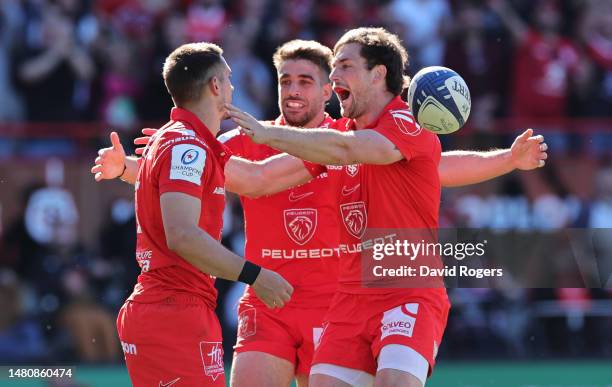 Thomas Ramos of Toulouse celebrates with team mates after scoring his second try during the Heineken Champions Cup match between Toulouse and Sharks...