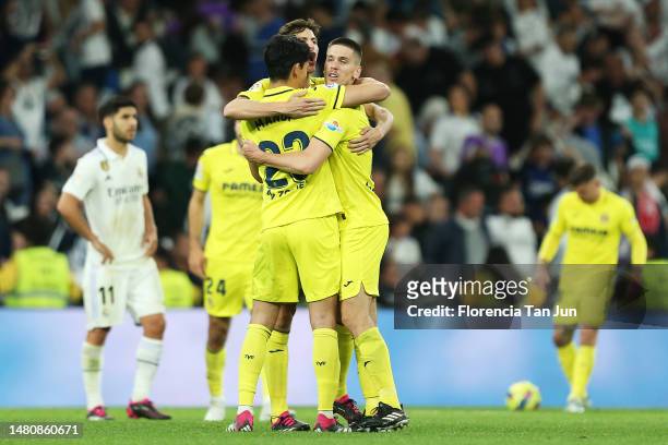 Aissa Mandi, Pau Torres and Juan Foyth of Villarreal CF celebrate victory after the LaLiga Santander match between Real Madrid CF and Villarreal CF...