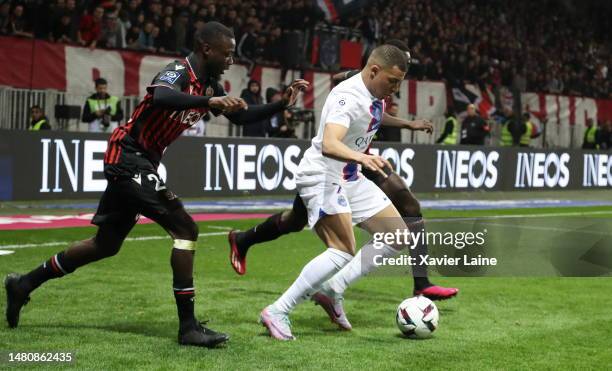 Kylian Mbappe of Paris Saint-Germain in action with Nicolas Pepe of Nice during the game between OGC Nice and Paris Saint-Germain at Allianz Riviera...