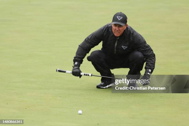 Phil Mickelson of the United States lines up a putt on the eighth green during the third round of the 2023 Masters Tournament at Augusta National...